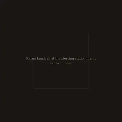 Rayna Lundvall at the piercing station marking a helix placement